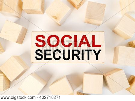 Social Security, Text On Wood Block On White Background