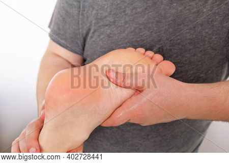 Massage Relax Studio. Toot Massage. Foot Massage In Spa Salon, Closeup. Woman Receives Leg Massage. 