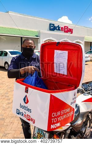 Express Service Home Delivery Man With Bike Outside Local Pick N Pay Grocery Store