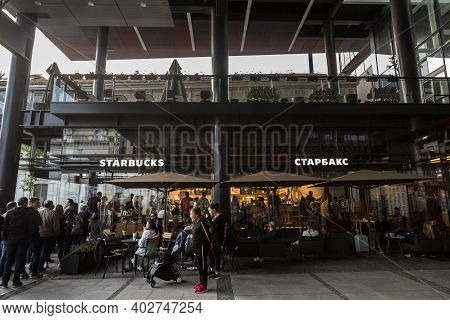 Belgrade, Serbia - April 28, 2019: People Queuing In Front Of A Starbucks Logo On Their Main Fast Fo