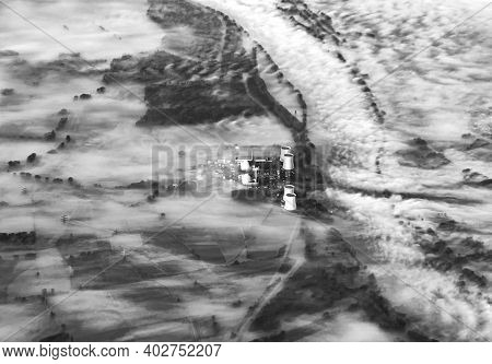 Aerial Of Rhine Valley Landscape In Morning Fog With Electric Pylons And Atomic Power Plant Biblis