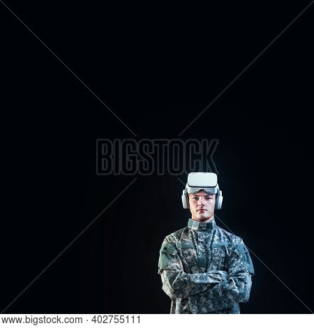 Soldier in VR headset for simulation training military technology black background