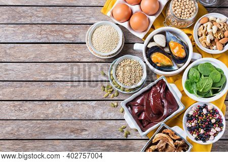 Healthy Nutrition Dieting Concept. Assortment Of Foods High In Iron. Beef Liver, Spinach, Eggs, Legu