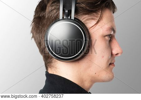 Man listening music with wireless headphones