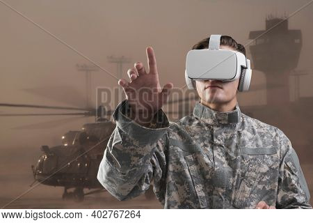 Military in VR headset touching virtual screen for simulation training military technology