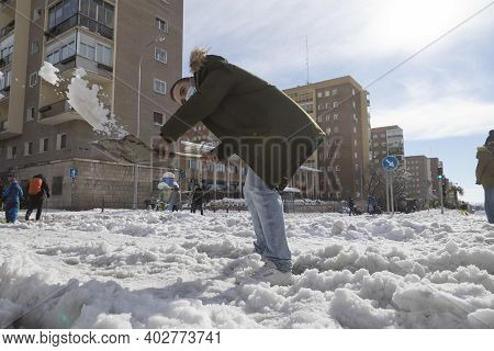 Madrid, Spain - January 10, 2021: Citizens And Neighbors Of Madrid, Collaborating And Cleaning The S