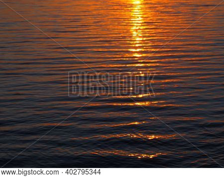 Orange And Dark Blue Waves During Sunrise