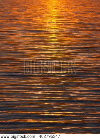 Orange And Dark Blue Waves During Sunrise