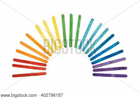 Rainbow Color Wooden Ice Cream Sticks On White. Multicolored Abstract Arc