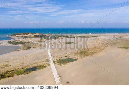 The Sand Dunes Of Paoay, Ilocos Norte, Philippines. Landscape With Trees And Sand Hills Near The Oce
