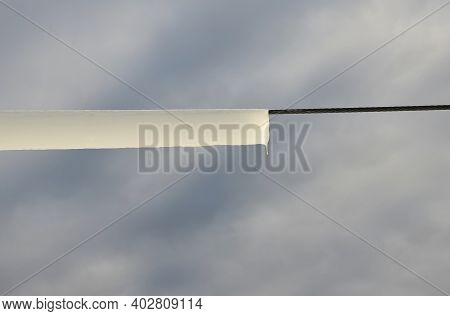 Power Lines Frozen By A Large Layer Of Ice In The Shape Of A Cylinder With Icicles. Icing Loads The 