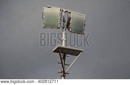 Power Lines Frozen By A Large Layer Of Ice In The Shape Of A Cylinder With Icicles. Icing Loads The 