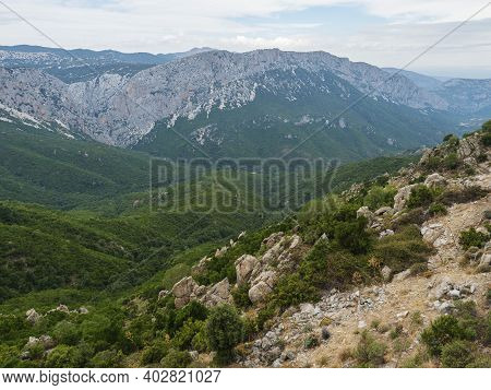 Aerial View Of Green Forest Landscape Of Supramonte Mountains With Limestone Rock And Mediterranean 