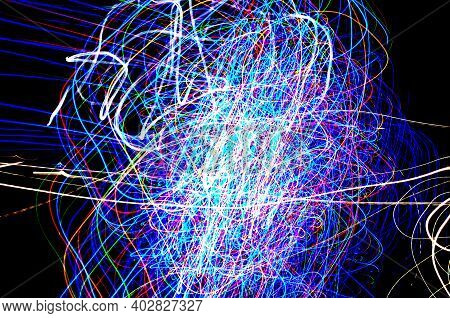 Abstract Tangled Lines On A Black Background Represent The Movements Of Electrons In Their Cosmic Or