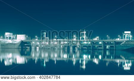 Reflection Of Night Hydroelectric Power Station In River. Vyshgorod, Ukraine.