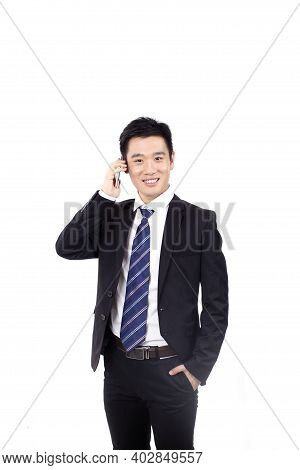 Portrait Of A Businessman Standing With Cellular Phono High Quality Photo