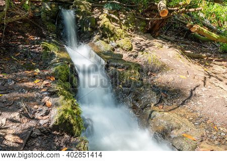 Long Exposure Of A Man Made Waterfall At Canonteign Falls In Dartmoor