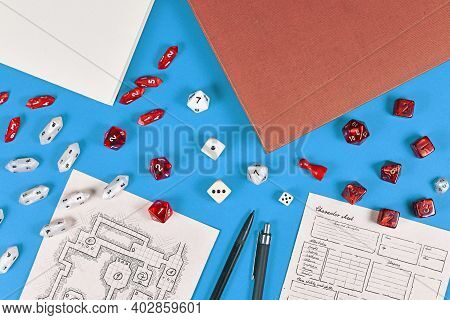 Tabletop Role Playing Flat Lay With Rpg Game Dices, Hand Drawn Dungeon Map And Character Sheer, Rule