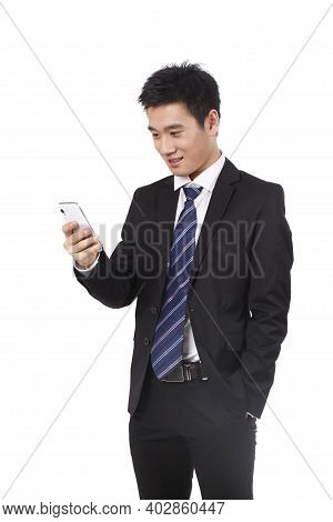 Portrait Of A Businessman Standing With Cellular Phono High Quality Photo
