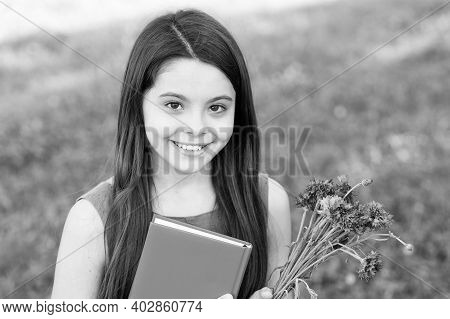 Happy Childrens Day. Happy Girl Got Flowers For Childrens Day. Little Child On Summer Outdoor. Child