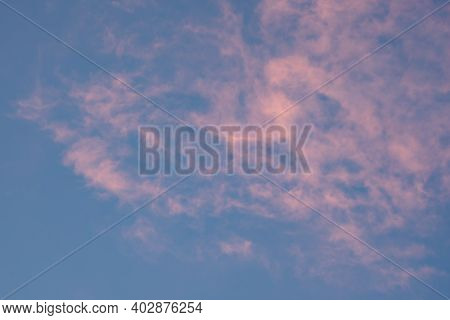 Whispy Clouds Turn Pink At Sunset Background Image