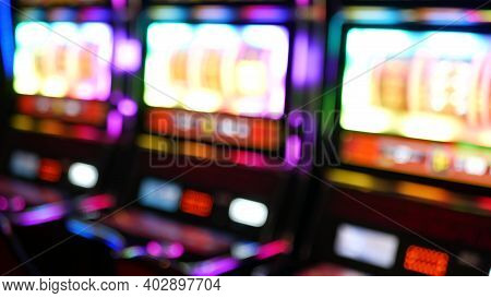 Defocused Slot Machines Glow In Casino On Fabulous Las Vegas Strip, Usa. Blurred Gambling Jackpot Sl