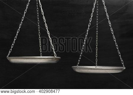 Empty Scales Close Up On Black Background. Balance Scales.