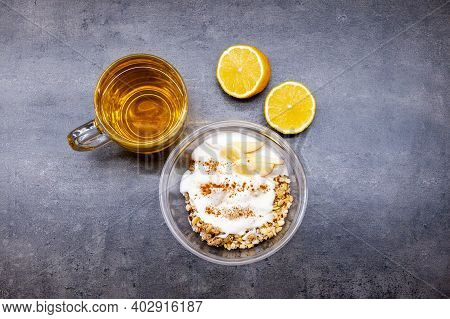 Healthyfood, Granola With Yogurt, Pineaple And Apple, Tea With Lemon. Heathy Breakfast