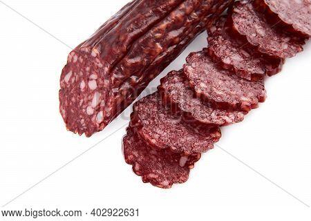Salami Smoked Sausage Piece Isolated On White Background. Salami, Salami Smoked Sausage. Smoked Meat