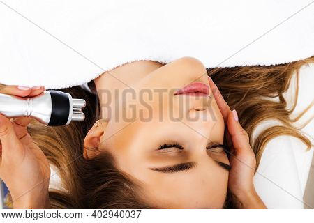 Photo Vacuum Rf Face Lifting. Biostimulation In A Beauty Salon. Skin Rejuvenation. Radio Wave Liftin