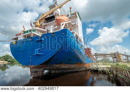 Ship Moored At Pier Under Loading. View From The Aft Stern Prow.