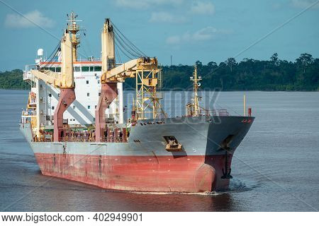 Multipurpose Cargo Ship Underway In The River.