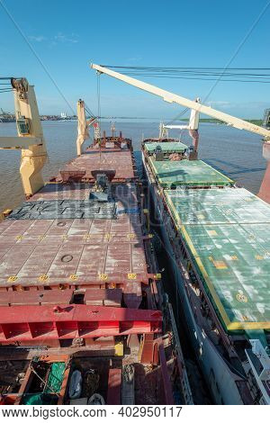 Two Ships Moored To Each Other At Roads.