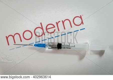 Riga, Latvia: January 12, 2021: Moderna Covid-19 Vaccine Concept. Close-up Of A Syringe And And, The