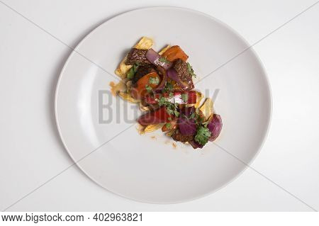 Typical Peruvian Food Called Lomo Salteado, Peru. White Background.