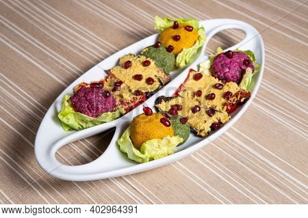 Georgian Snack Called Phali With Salad On A White Plate
