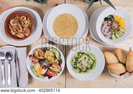 Set With Dishes From Spanish Bar Poke Bowl, Cozido Madrileno, Gambas, Tagliatelle, Salad With Goat C