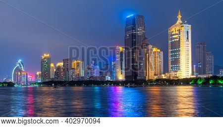Xiamen, China skyline on Yundang Lake at twilight.