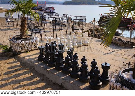 Solina, Poland - September 05, 2018: Huge Chess Pieces On The Beach. Entertainment For Tourists.