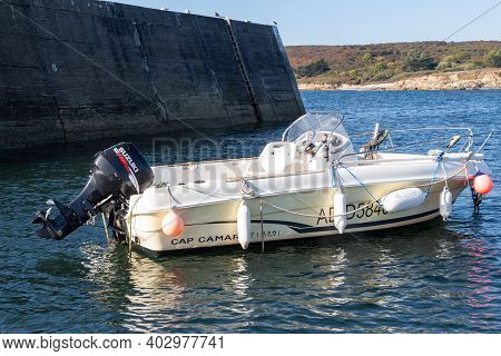 Primelin - France, October 04, 2018 : Cap Camarat Boat With Suzuki Motor At Anchor In Primelin Harbo
