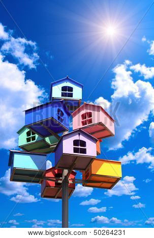 Colorful nesting boxes on blue sky
