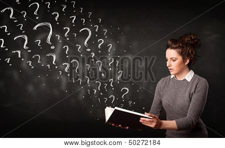 Confused woman reading a book with question marks coming out from it