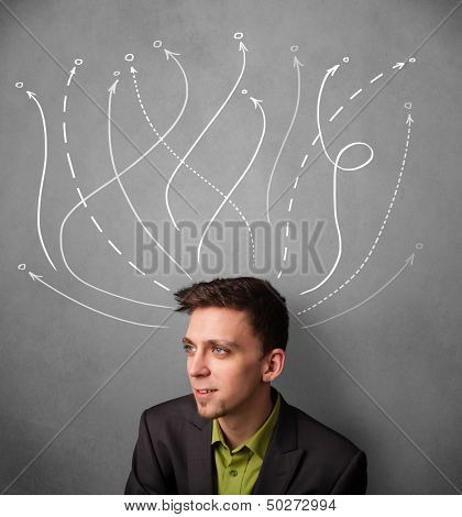 Young businessman thinking with arrows in different directions above his head