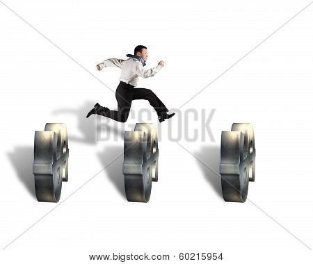 Businessman Jumping Over Money Symbol Obstacles