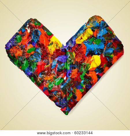 a heart splashed with paint of different colors on a beige background with a retro effect
