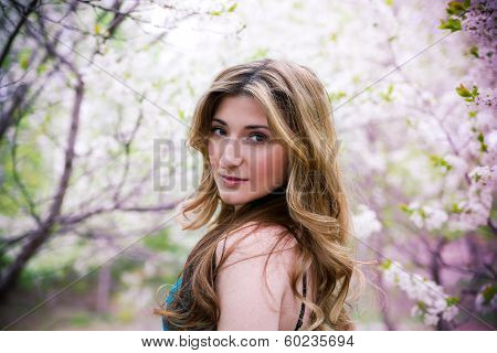 Beautiful Young Woman With Flowers.