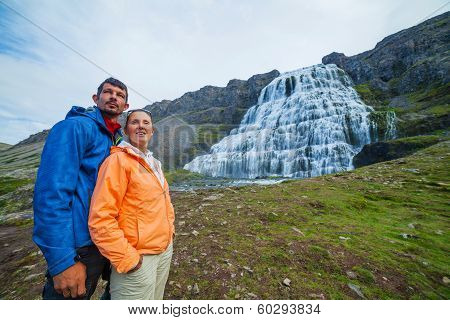 couple of tourists and Dynjandi. Iceland