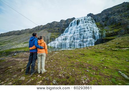 couple of tourists and Dynjandi. Iceland