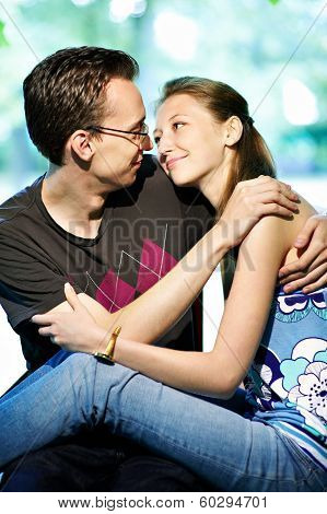 Girl With Boys On Park Bench