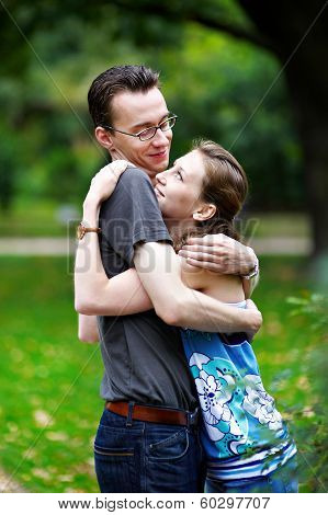 Girl With Boys On Park Bench